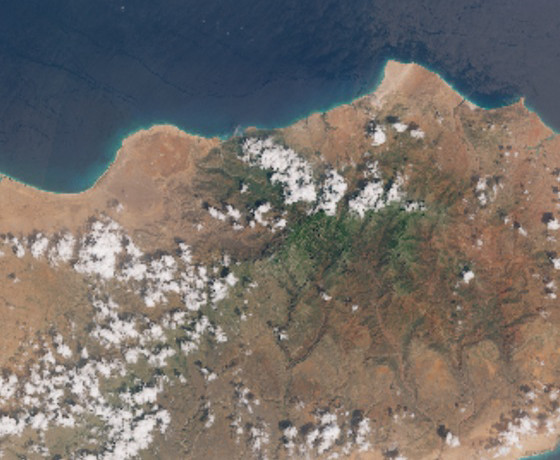 Sentinel-2 satellite image of Socotra Island, 22 October 2015 — a calm high-resolution view ten days before Cyclone Chapala made landfall. The arid lowlands and turquoise shallow-water coastline are sharp at 10 metre resolution; the central east of the island shows the dark green Hajhir Mountains where the Dragon Blood Trees grow.